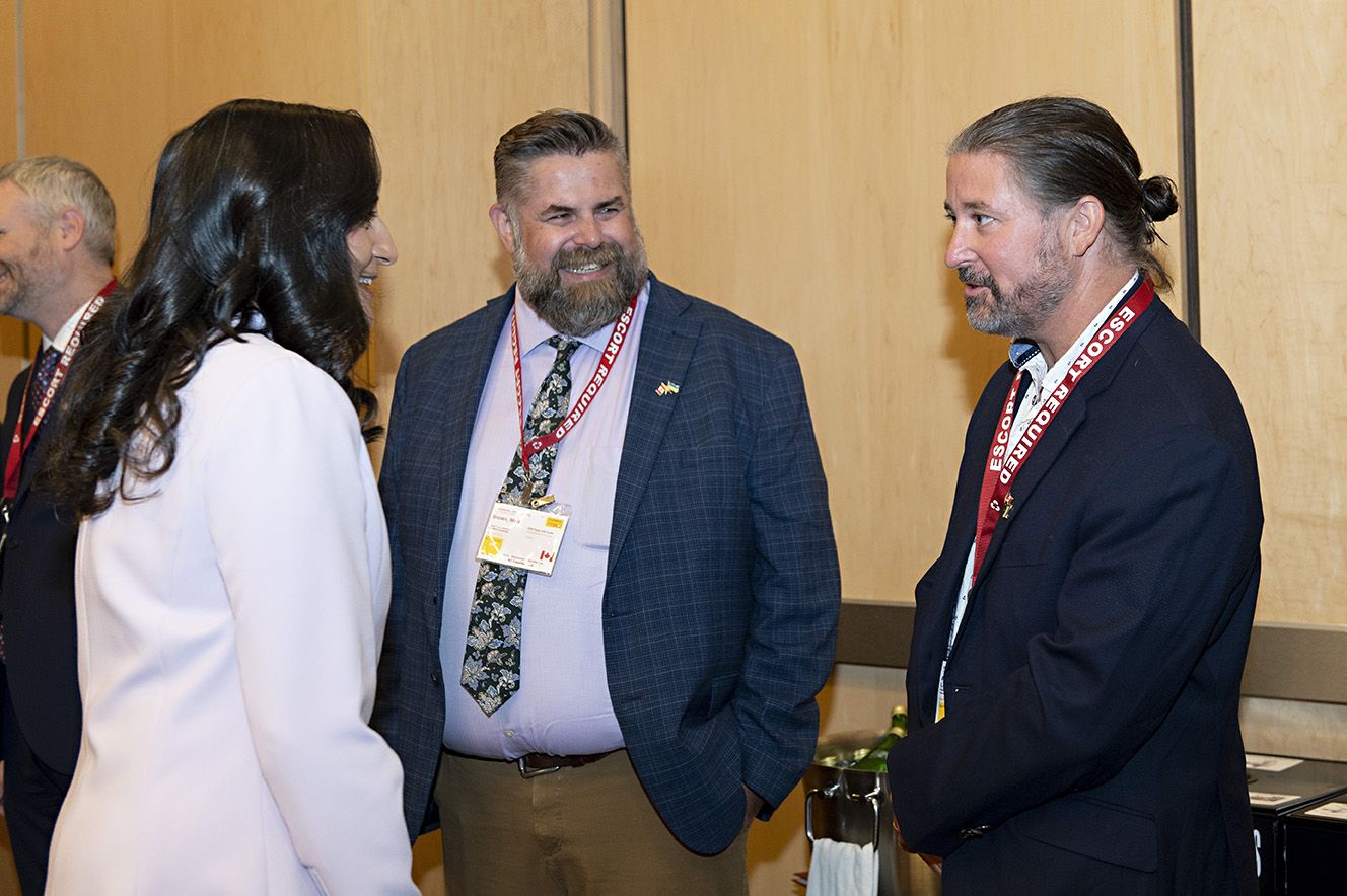 CEO Len Anderson in conversation with Minister of National Defense, Anita Anand, and another event participant.