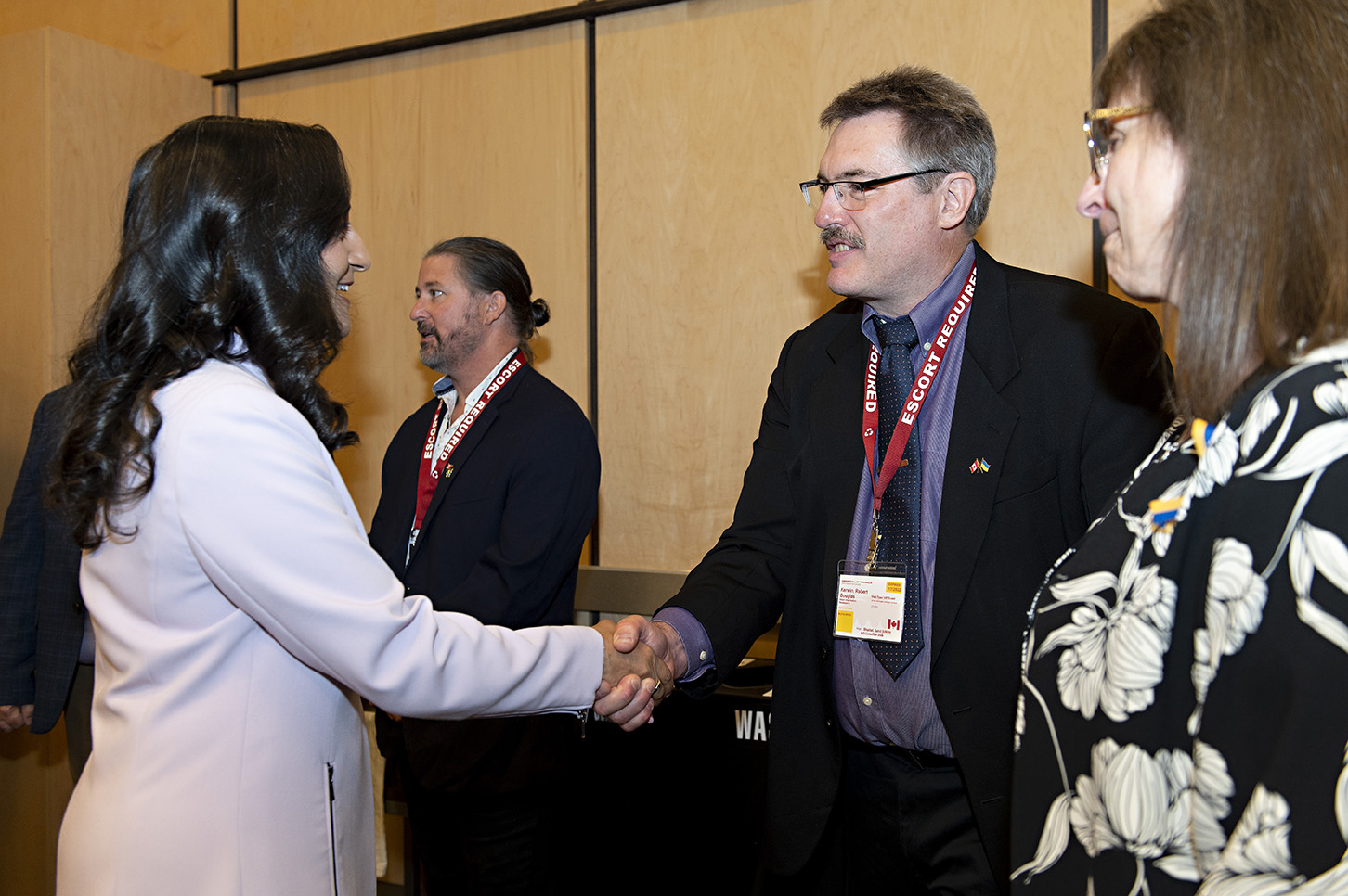 General Manager of Terra Nova Doug Kerwin shaking hands with Minister of National Defense, Anita Anand.