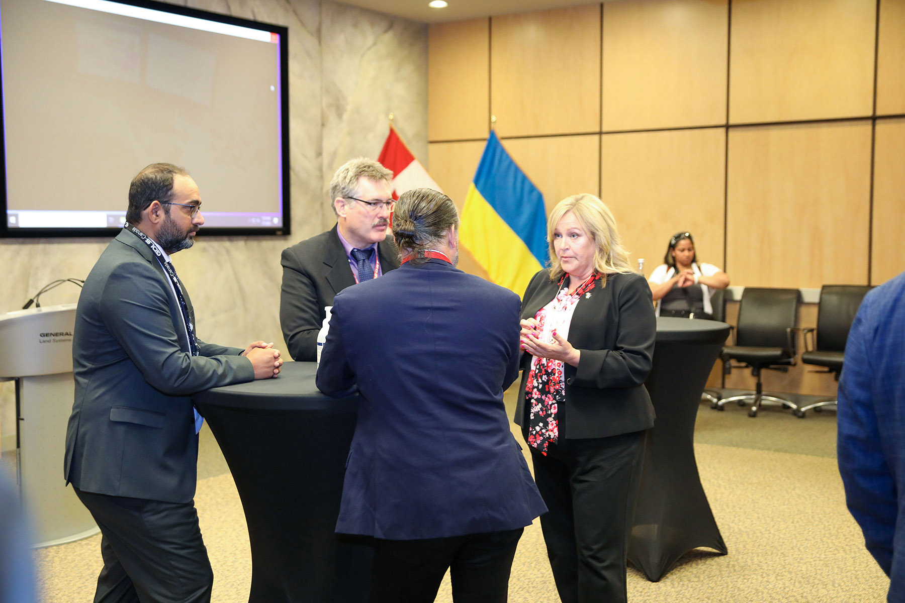 CEO Len Anderson and General Manager of Terra Nova Doug Kerwin in conversation with two other members of the event.